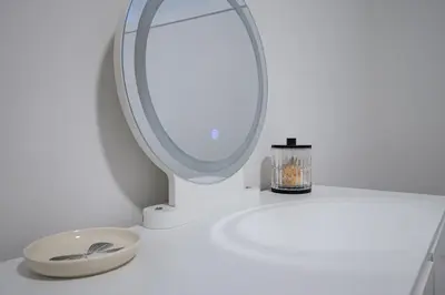 a white bathroom with a mirror and a sink at Trendy & Spacious Sleeps 9 AC Db Garage in Edmonton