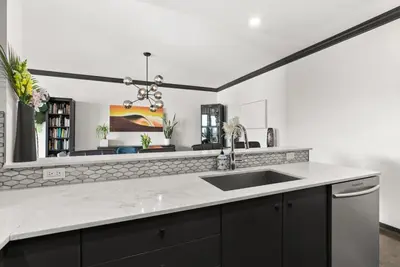 a kitchen with a sink and a counter top at Large 1br Sub-Penthouse Near Science World in Vancouver