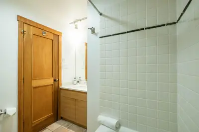 a bathroom with a shower and a toilet and a sink at Taluswood 6 by Outpost Whistler in Whistler