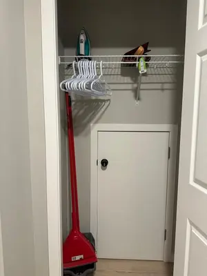 a room with a red mop and a closet at Oisede in Edmonton
