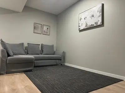 a living room with a couch and a rug at Oisede in Edmonton