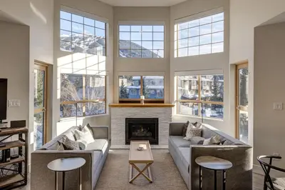 a living room with a couch and a fireplace at Tyndall Stone 317 by Outpost Whistler in Whistler