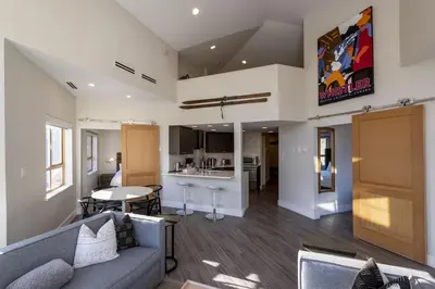 a living room with a couch and a table at Tyndall Stone 317 by Outpost Whistler in Whistler