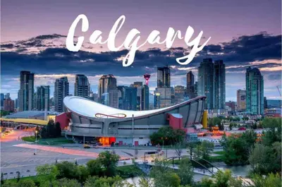 a sign that reads calgary with a city in the background at MicroNest - Modern Overlooking Downtown Parking in Calgary