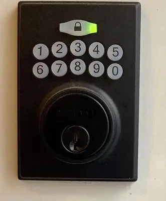 a black remote control sitting on a table at Sapphire Lux Queen Suite in Kamloops
