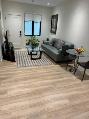 a living room with a couch and a table at Delux 2 bedroom suite in White Rock