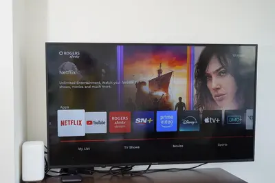 a flat screen tv sitting on top of a desk at Center of the City in Vancouver