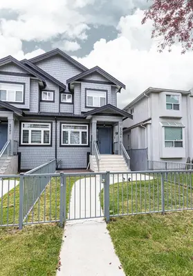 a house with a gate in front of it at Dumfries Guest Room in Vancouver in Vancouver
