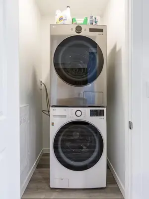 a washer and dryer in a small room at DT Edmonton King Suite with Parking & 100 Walk Score in Edmonton