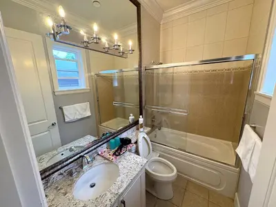 a bathroom with a sink and a toilet and a shower at Kane Jolly Lodge in Richmond