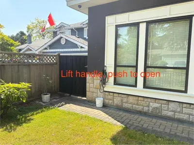a house with a window with the words lift handle push to open at Kane Jolly Lodge in Richmond