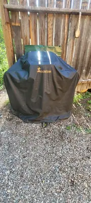 a black tarp on the ground next to a fence at Beautiful Cabin near Radium Hot Springs with private hot tub in Radium Hot Springs