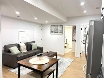 a living room with a couch and a table at Luxe Stay with a Designer Touch in Calgary