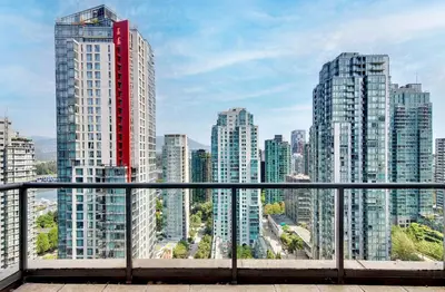 a view of a city skyline with tall buildings at Luxury 2BR Designer Apartment In The Heart Of Downtown! in Vancouver