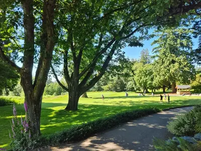 a park with trees and people walking on a path at Cozoro 3 BEDROOMS Centre Vancouver in Vancouver