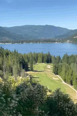 a golf course with a view of a lake at The HI-Mark House - Hot tub,AC,Pool table, Pool May2026 in Sicamous
