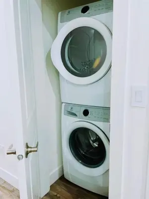 a washing machine and a dryer in a room at Langley home in Maple Ridge District Municipality