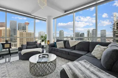 a living room with a couch and a table at Urbanest - Spectacular Views & Amenities Parking in Calgary