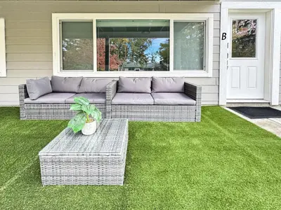 a couch sitting on a lawn in front of a house at Renovated Suite in WL, 5 Min to Downtown, All New Appliances, Self Check-In in Williams Lake