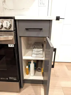 an open drawer in a kitchen with a stove at Luxury Guest Suite in Calgary in Calgary