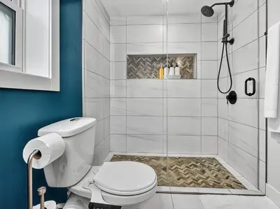 a bathroom with a toilet and a shower at Private Studio - 5 Min to DT - Self Check-In - 75 Inch TV in Williams Lake