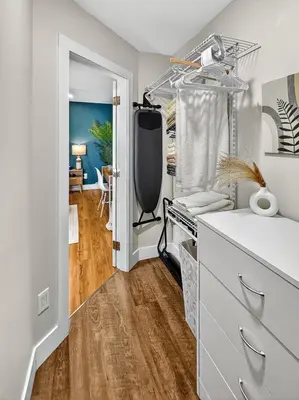 a room with a white dresser and a dining room at Private Studio - 5 Min to DT - Self Check-In - 75 Inch TV in Williams Lake