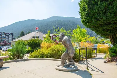 a statue of a monkey standing in a park at The Driftwalk Walkable to Beach in Harrison Hot Springs