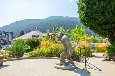 a statue of a monkey standing in a park at RiversTail Retreat Pet-Friendly and Steps to The Lake in Harrison Hot Springs