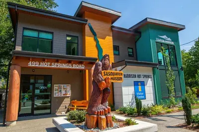 a wooden statue in front of a building at The Backyard at Cedar Springs Walk to Lake and Hot Springs in Harrison Hot Springs