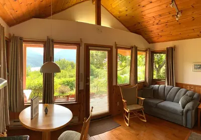 a living room with a couch and a table at Wing Creek Resort in Kaslo