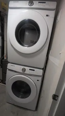 a washing machine and a dryer in a room at Cozy Escape Guest Suite in Edmonton