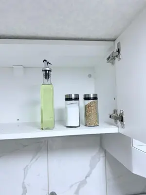 a shelf with two bottles of soap on it at Spacious 2 bedroom 3 beds lower unit with separate entrance and parking space Near Downtown, Calgary Zoo, Costco and many more in Calgary