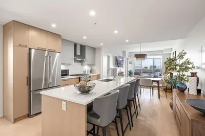 a kitchen with a large island with a counter top at Sidney Sunnyside - Luxurious Seaside Living in Amazing Sidney by Victoria Prime! in Sidney