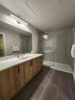 a bathroom with a large sink and a shower at Riverstone Retreat in Golden BC in Golden