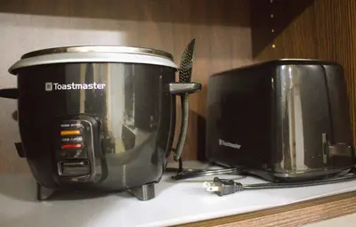 a slow cooker and a toaster on a kitchen counter at Entire suite Queen BRM Big Window Prvt Entry Patio in Edmonton