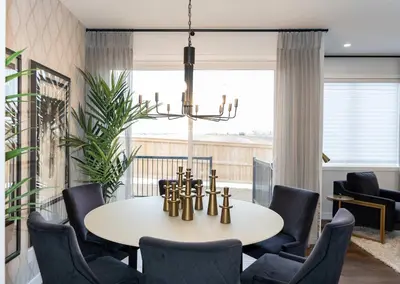 a dining room with a table and chairs at Strawberry Fields 4BD Family Movie Room Office in Calgary