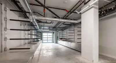 an empty room with pipes on the wall at AQUA Corner Unit w Balcony and Amazing View #614 in Kelowna