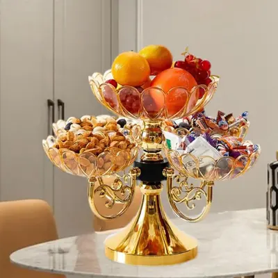 a bowl of fruit on a gold stand on a table at Cozy Nook in Fraser Valley Getaway with Breakfast in Abbotsford