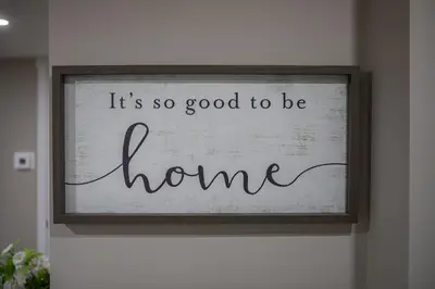 a sign that says it is so good to be home at Modern 2-Bedroom Suite with Private Access - 10 minutes from Calgary Airport in Calgary