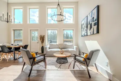 a living room with a couch and chairs and a table at Mountain View Hideaway - BBQ, Beach Access in Invermere