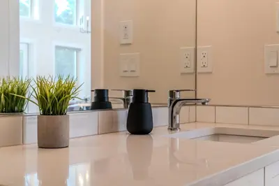 a kitchen counter with a sink and a faucet at Mountain View Hideaway - BBQ, Beach Access in Invermere