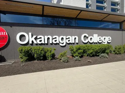 a sign on the side of a building at Residence & Conference Centre - Kelowna in Kelowna