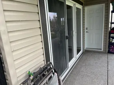 a porch with a bench next to a door at The Flight Line in Calgary