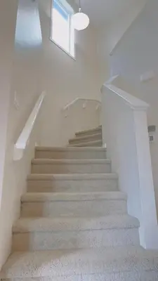 a staircase in a house with a window at Calgary Airport Getaway Spacious 3BR Full Home in Calgary