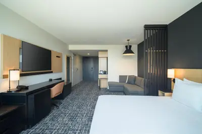 a hotel room with a bed and a flat screen tv at Hyatt Place Whitehorse in Whitehorse