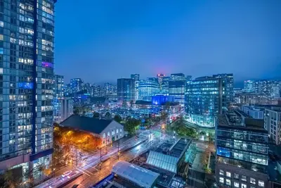 a view of a city at night at Downtown Condo with Great City Views in Vancouver