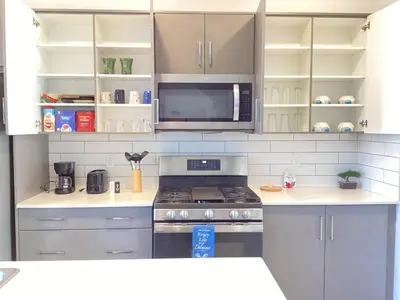 a kitchen with a stove and a microwave at Home in west Edmonton in Edmonton