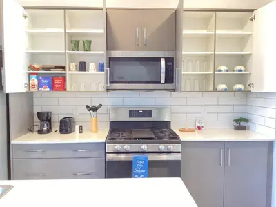a kitchen with a stove and a microwave at Home in west Edmonton in Edmonton