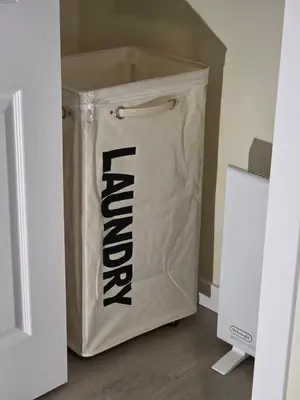 a large plastic bag sitting on the floor in a room at Haven YYC Guest Suite in Northwest Calgary in Calgary