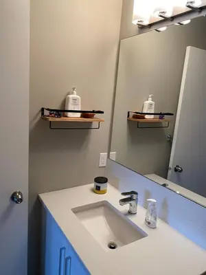 a bathroom with a sink and a mirror at Heart of Vernon in Vernon
